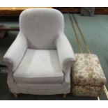 A 20th century cream upholstered armchair, 92cm high x 80cm wide x 80cm deep and a floral