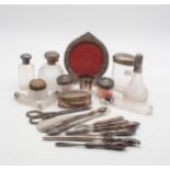 A collection of silver including glove stretchers, shoe horns, crochet hooks, scent bottles,