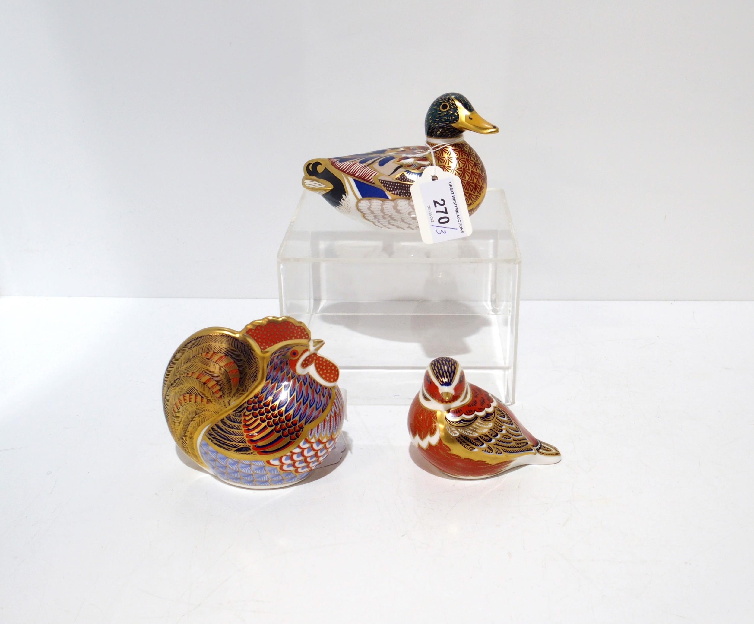 Three Royal Crown Derby paperweights including Mallard duck, Chaffinch, both gold stoppers and