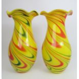 A pair of dramatic bright yellow Murano glass vases with green and red swirling decoration with