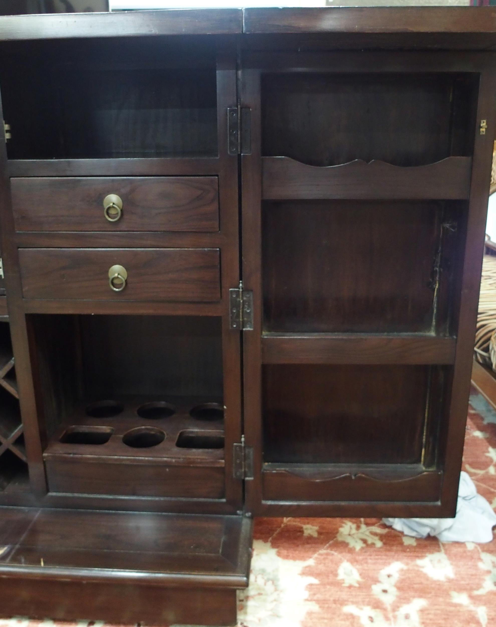 A 20th century Oriental hardwood drinks cabinet with pair of fold out top concealing marble insert - Image 5 of 8