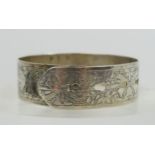A CHARLES HORNER hallmarked silver bangle in the form of a belt with adjustable buckle design