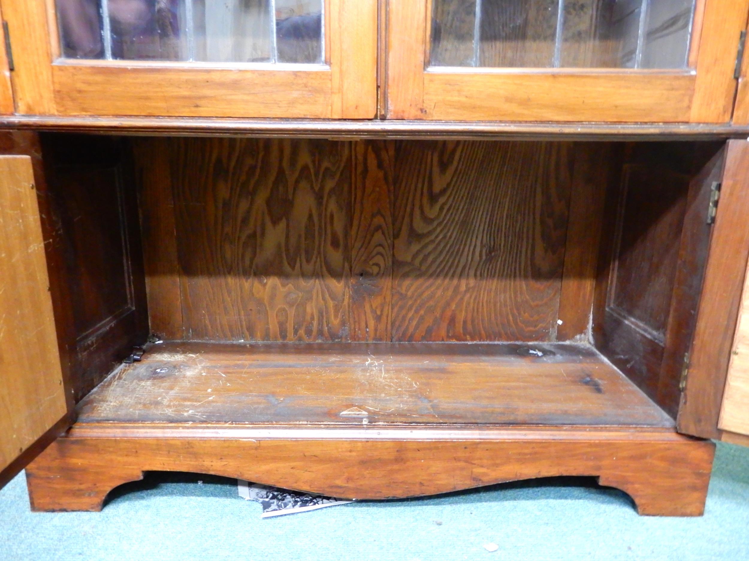 An early 20th century mahogany glazed bookcase with moulded cornice over pair of leaded glass - Image 2 of 5