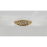 An 18ct gold classic five stone diamond ring with scroll mount. This pretty ring is set with rose