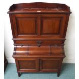 A Victorian mahogany fall front writing desk with fall front writing compartment over single