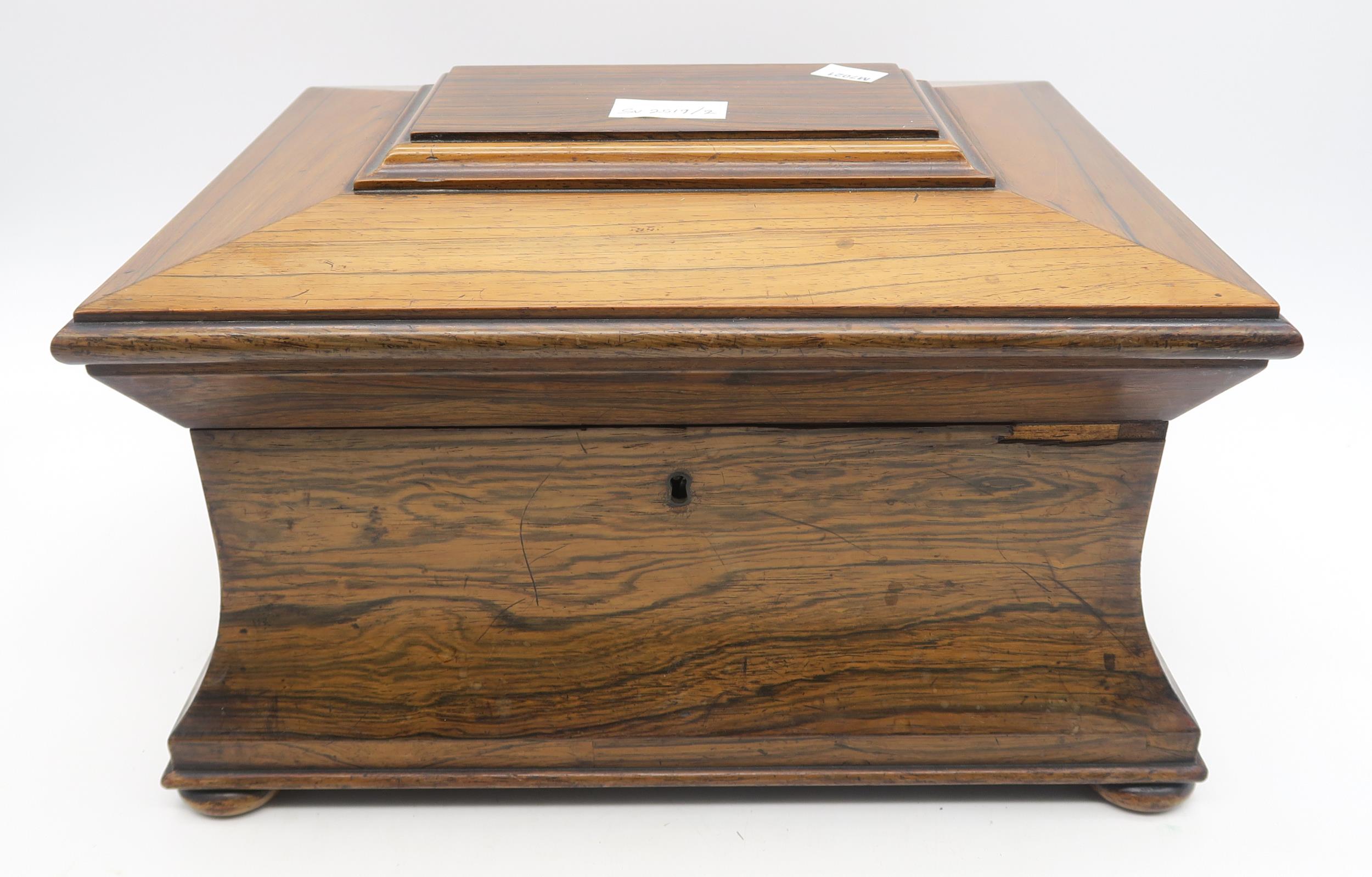 A large Victorian rosewood sarcophagus-form jewellery casket, the hinged lid opening to reveal a