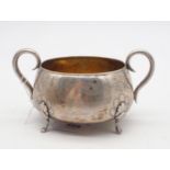 A Danish silver sugar bowl, of round form with two scrolling handles, the body engraved with