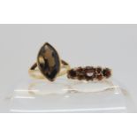 A 9ct gold marquis shaped smoky quartz ring, size K, together with a garnet set ring, size L1/2,