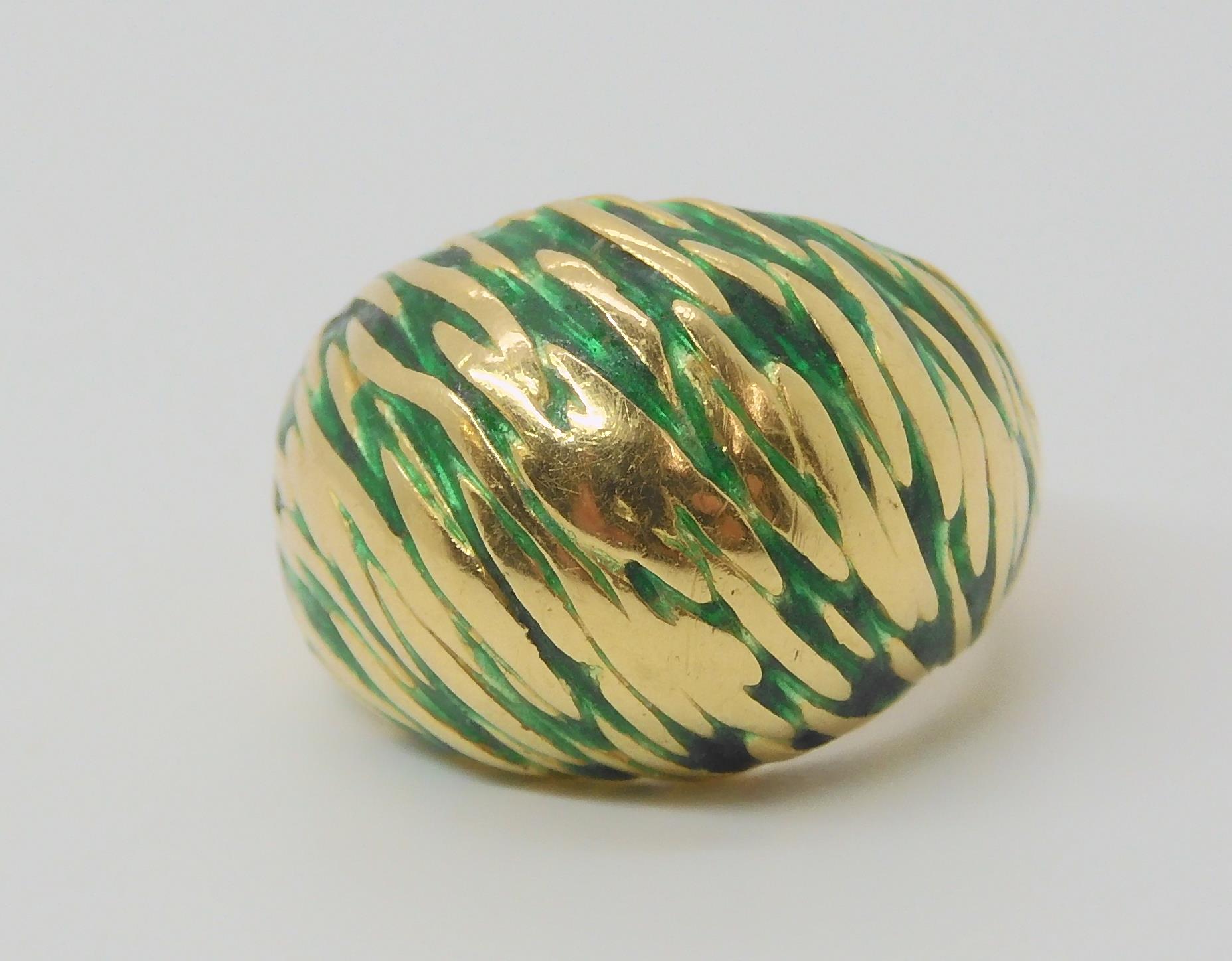 A KUTCHINSKY ENAMEL RING the 18ct yellow gold high domed ring is enamelled in green to the