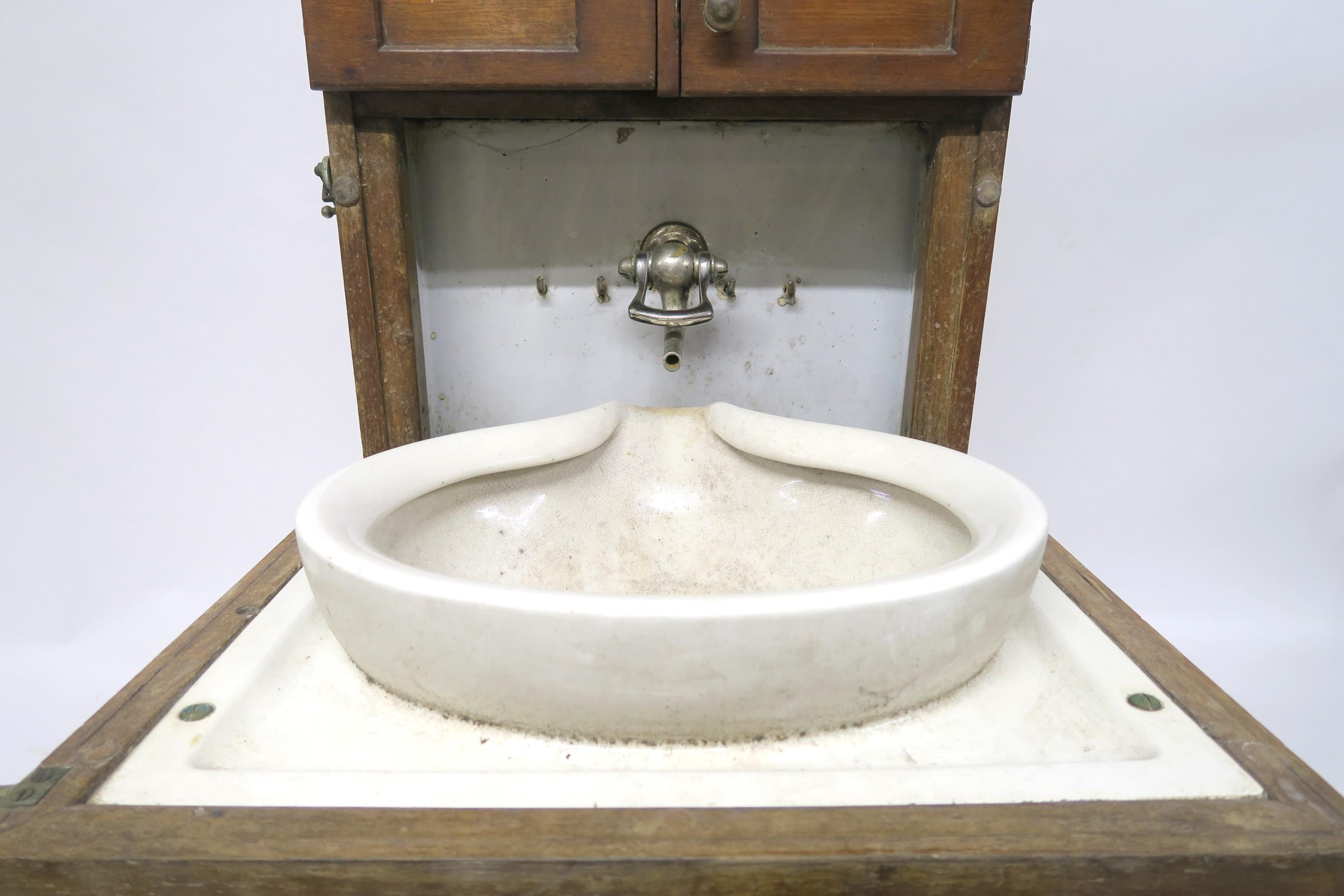 A 19/20TH CENTURY TEAK SHIPS CABIN WASH STAND with three asymmetrical cabinet doors over fall - Image 4 of 10