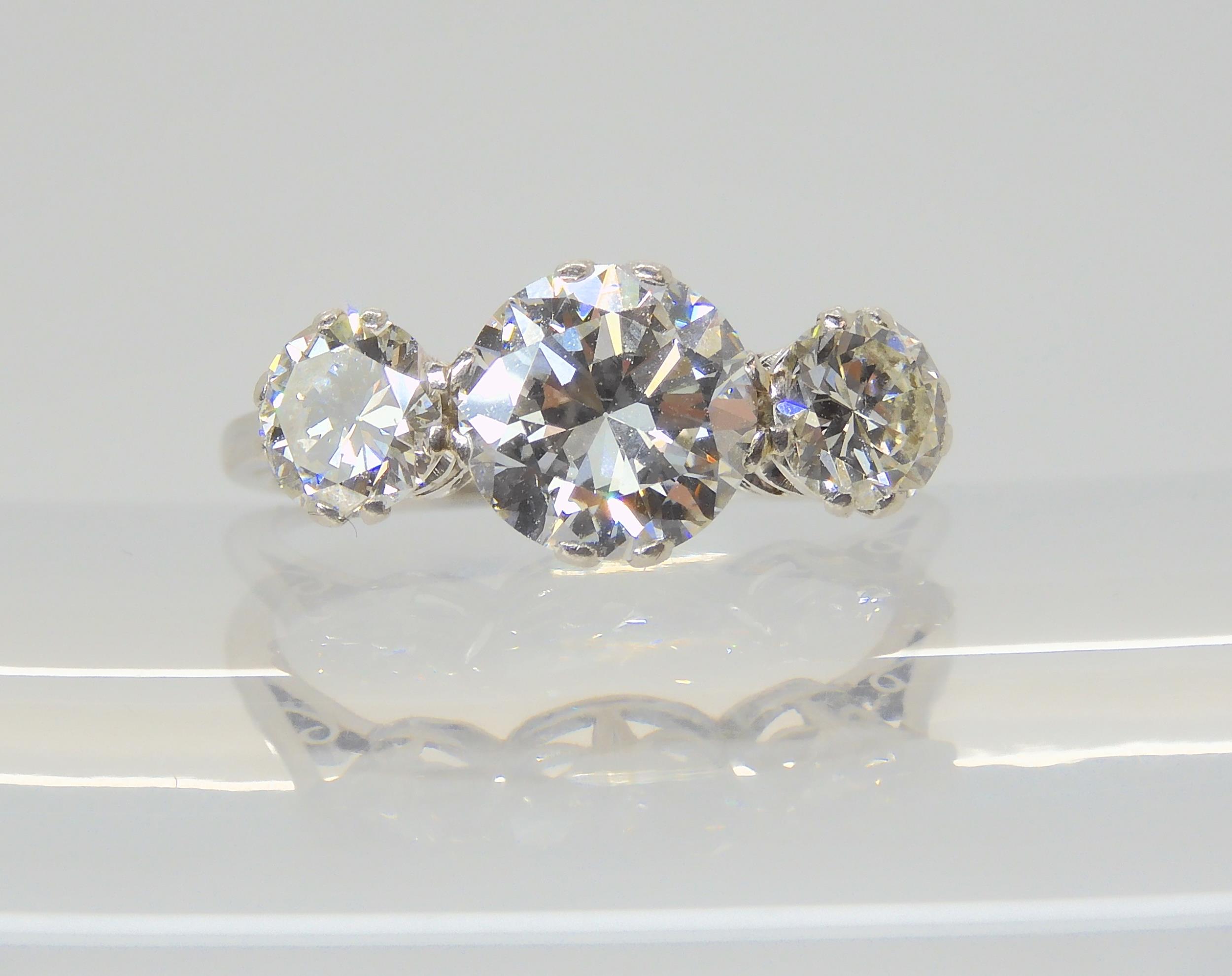 A SUBSTANTIAL DIAMOND THREE STONE RING mounted throughout in platinum, with a really pretty setting. - Image 4 of 8