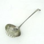A GEORGE III SILVER SOUP LADLE in a beaded Old English pattern, with a circular shell bowl, with