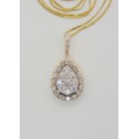 A DIAMOND SET PENDANT AND CHAIN from the Jewellery Channel Iliana collection, the 14k gold pear