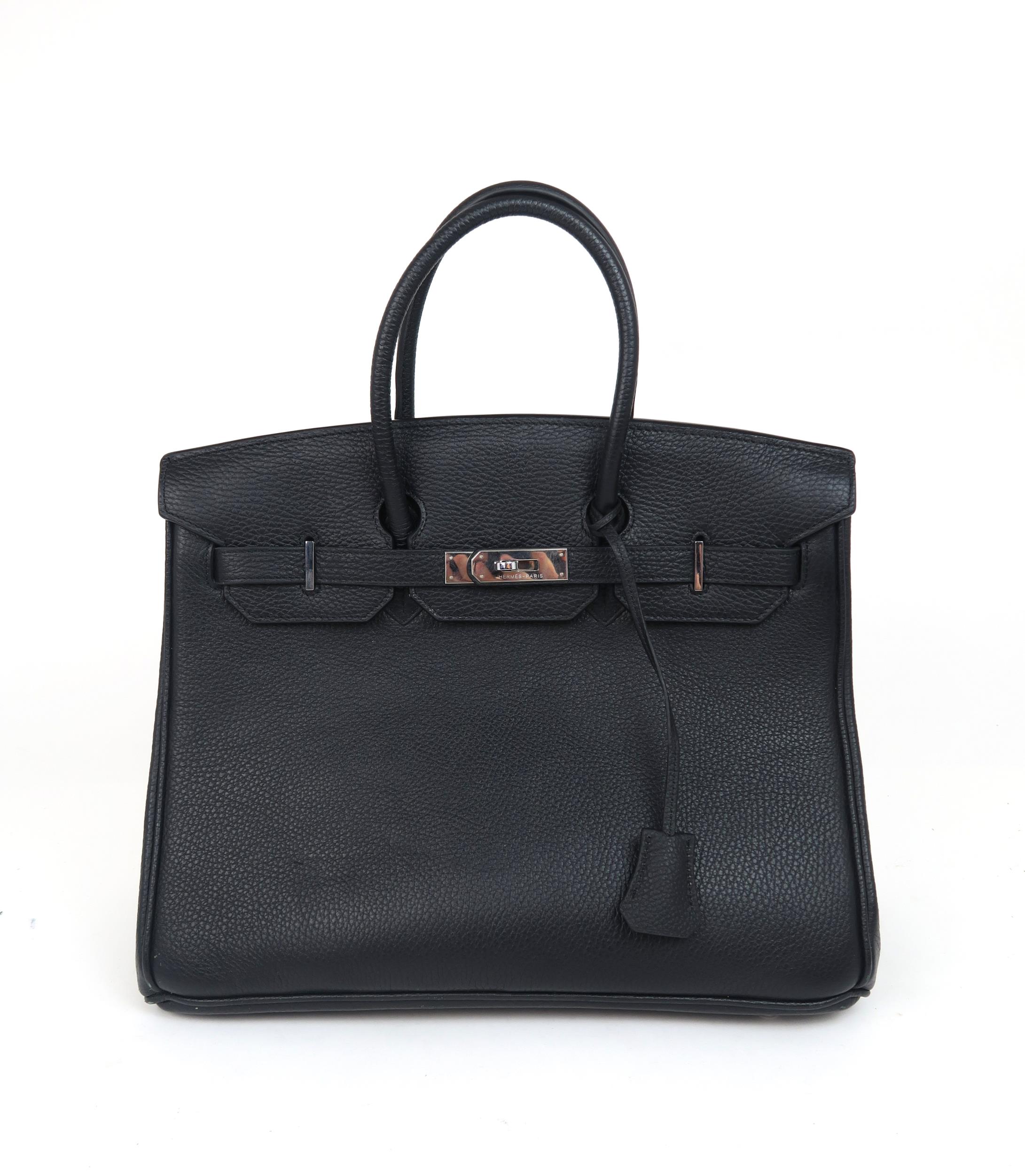 A HERMES 2010 BLACK BIRKIN 35 HANDBAG the pebbled leather exterior with dual rolled handles, top