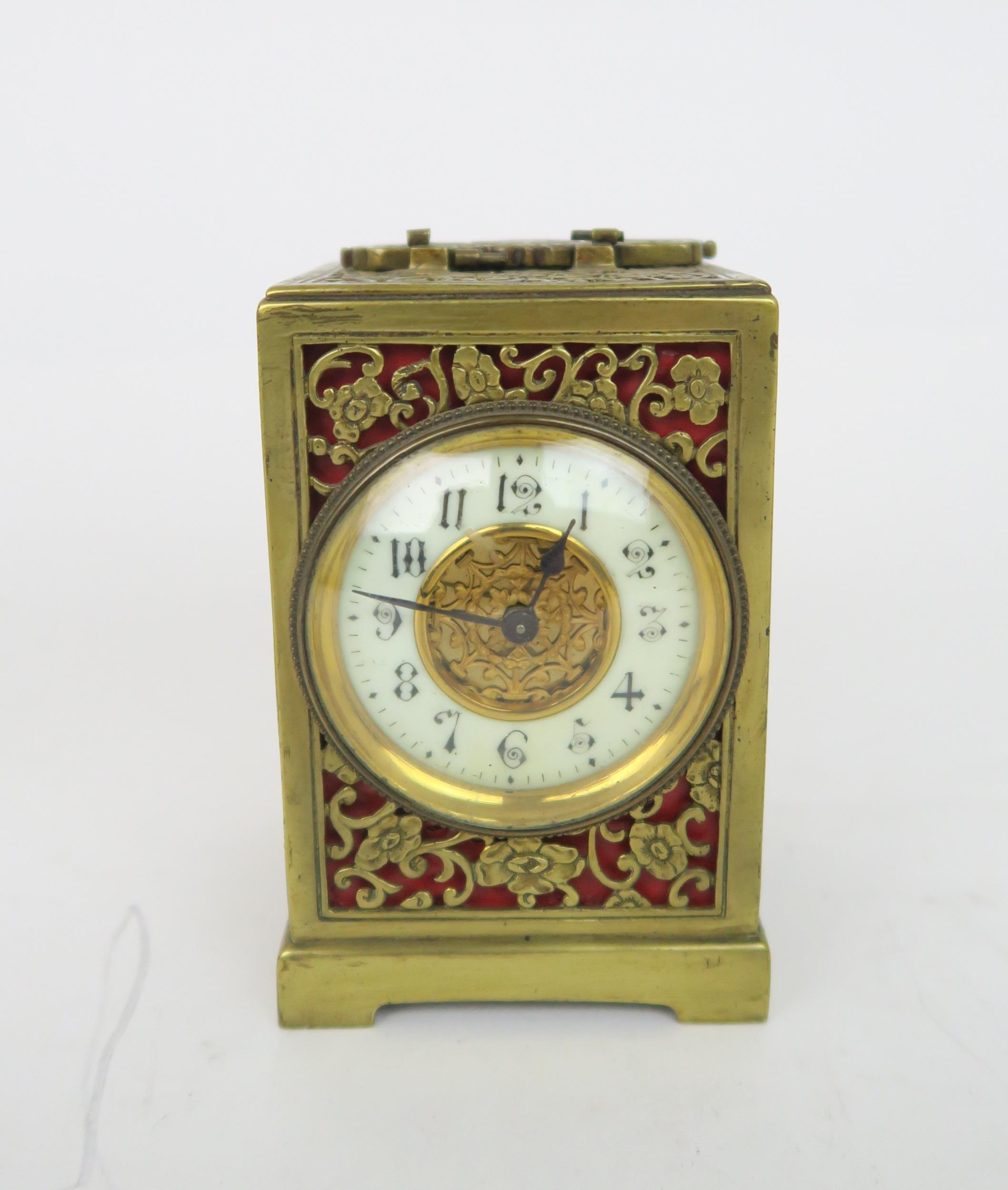 A PIERCED BRASS TIMEPIECE with red lining, the white enamel dial ring with Arabic numerals, 12cm - Image 2 of 12