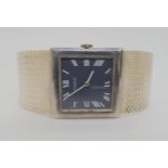 A GENTS VINTAGE SILVER TISSOT WRISTWATCH with square blue dial white roman numerals and hands.