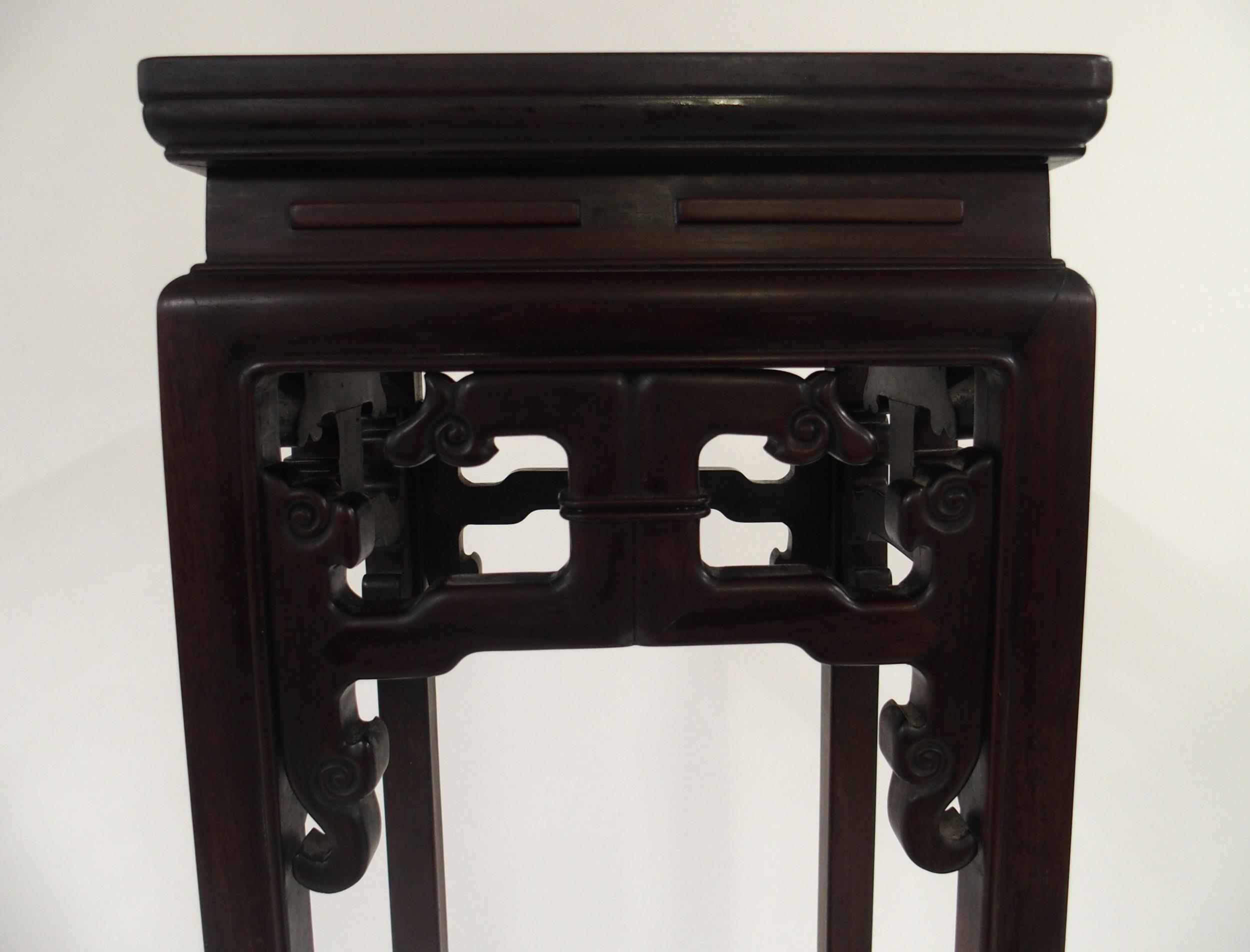 A 20TH CENTURY CHINESE HARDWOOD PLANT PEDESTAL with square top over carved fretwork friezes on - Image 4 of 8