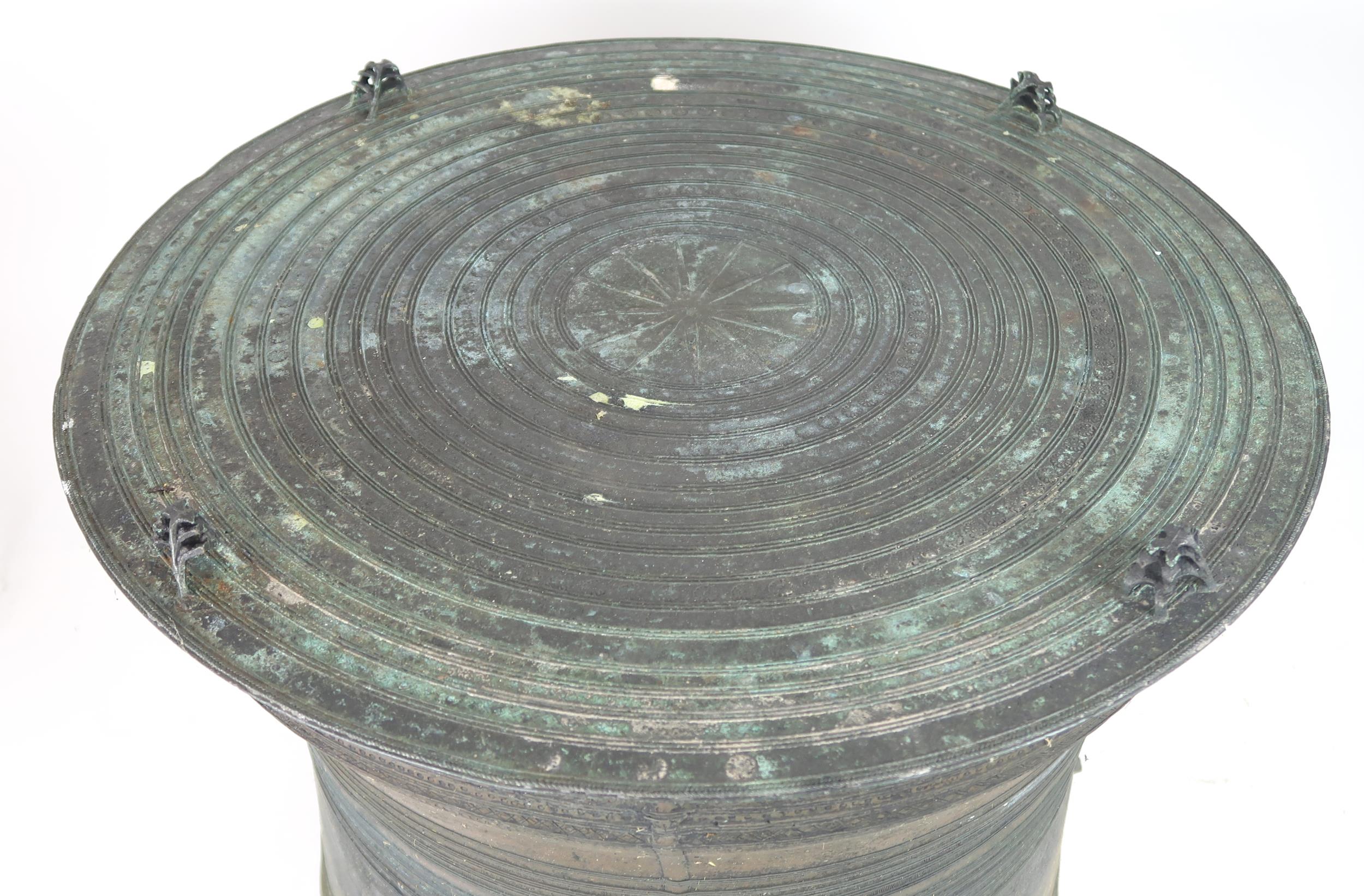 A LAOTIAN BRONZE RAIN DRUM  Of traditional type, with applied animals to top and pierced strap - Image 3 of 11