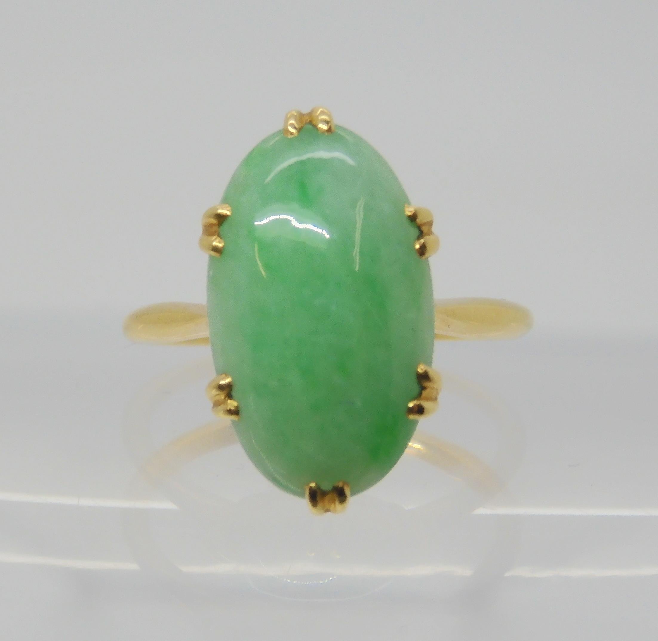 A CHINESE GREEN HARDSTONE RING mounted in bright yellow metal, the hardstone measures approx 16mm - Image 2 of 4
