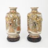 A PAIR OF SATSUMA VASES  Each applied with moulded gilt dragons, enclosing Kannon and Sennin