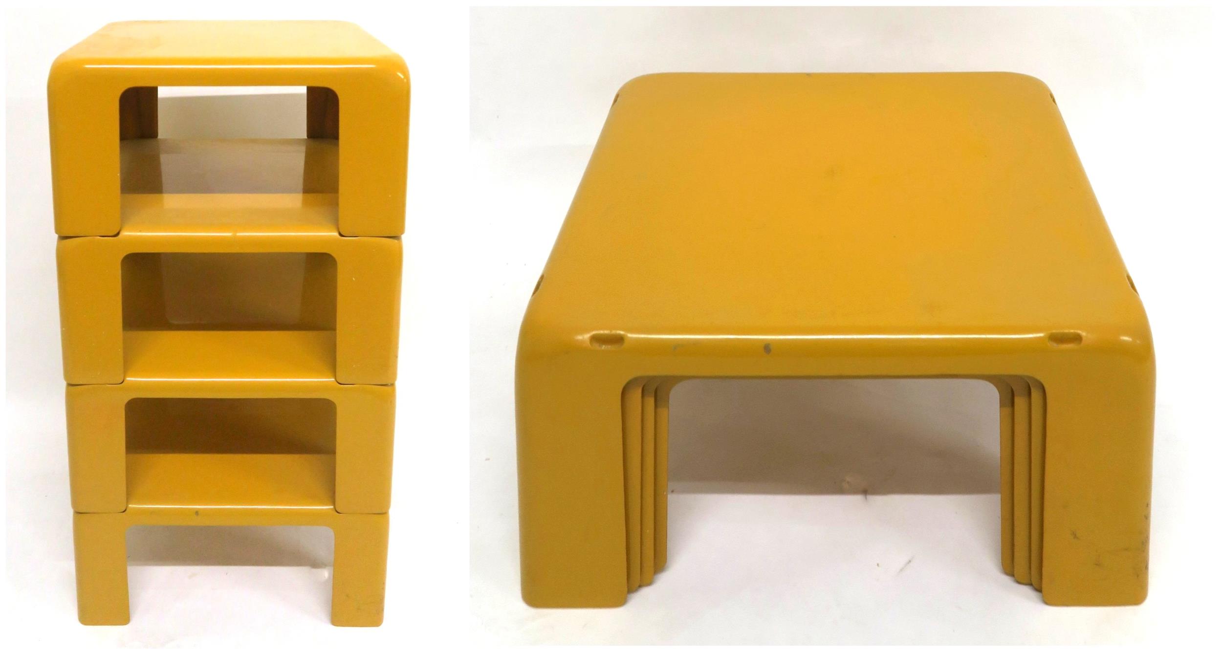 A MID 20TH CENTURY MARIO BELLINI NEST OF FOUR STACKING TABLES moulded from mustard coloured