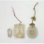 A CHINESE JADE PENDANT  Carved with a central foliate medallion 5.5 x 4.6cm, a rectangular pendant