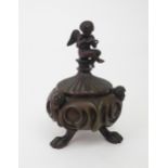 A 19TH CENTURY BRONZE COPY OF PETRATCH'S INKSTAND modelled upon three paw feet, the body with cherub