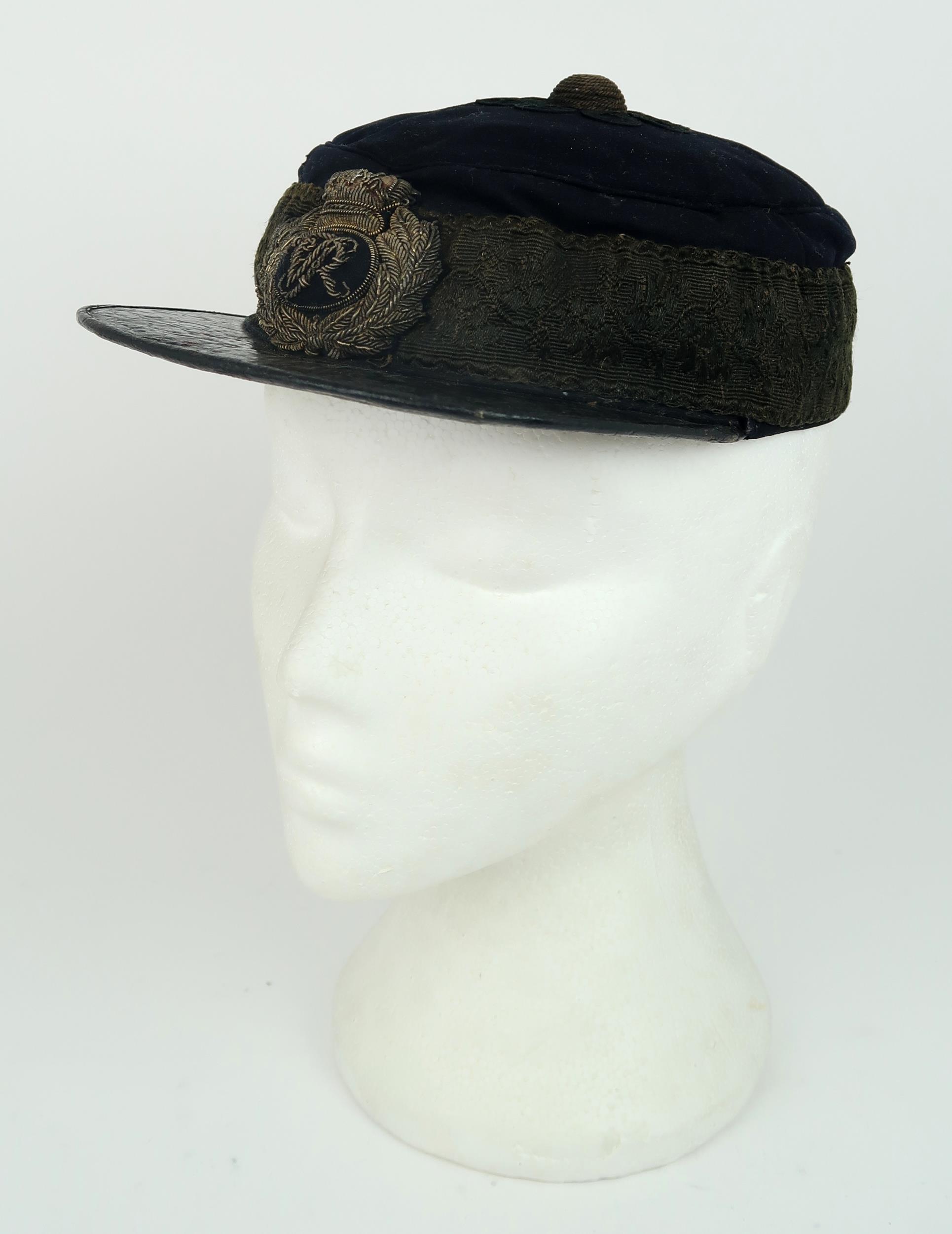 A VICTORIAN GENERAL SERVICE KEPI/FORAGE CAP With patent leather peak, cord central boss, broad