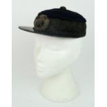 A VICTORIAN GENERAL SERVICE KEPI/FORAGE CAP With patent leather peak, cord central boss, broad