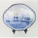 A LARGE 19TH CENTURY COMMEMORATIVE DUTCH DELFT BLUE AND WHITE SHAPED OVAL PLAQUE by Makkum,