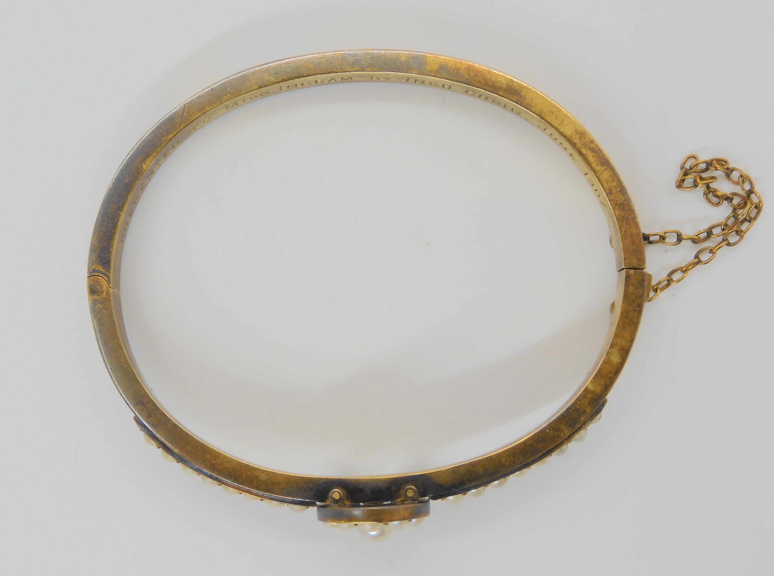 A PEARL SET HORSESHOE BANGLE mounted in yellow metal, with inscription to the inner shank dated - Image 4 of 5