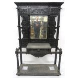 A VICTORIAN EBONISED JACOBEAN REVIVAL MIRROR BACK HALL STAND with rectangular bevelled glass