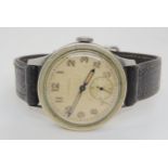 A VINTAGE LONGINES stainless steel case, silvered dial, Arabic numerals, subsidiary seconds dial and