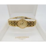 A GOLD PLATED LADIES LONGINES les grande classiques, du Longines, with gold coloured dial, baton