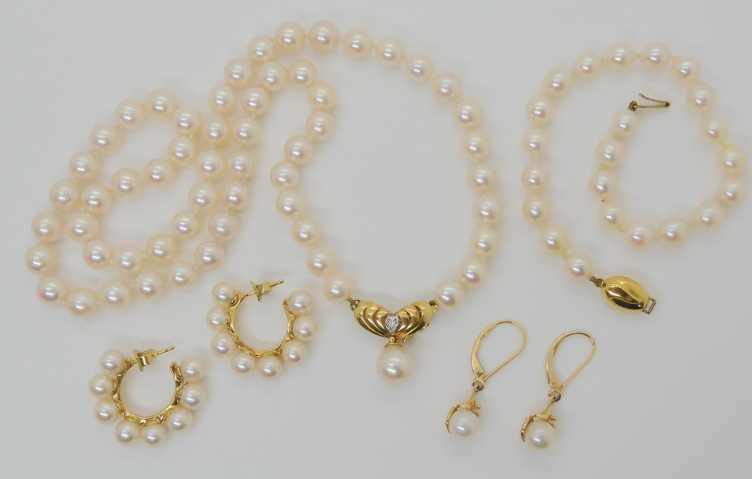 A PEARL SUITE the pearl necklace with diamond set 18ct gold pendant clasp, has a 8.5mm pear shaped