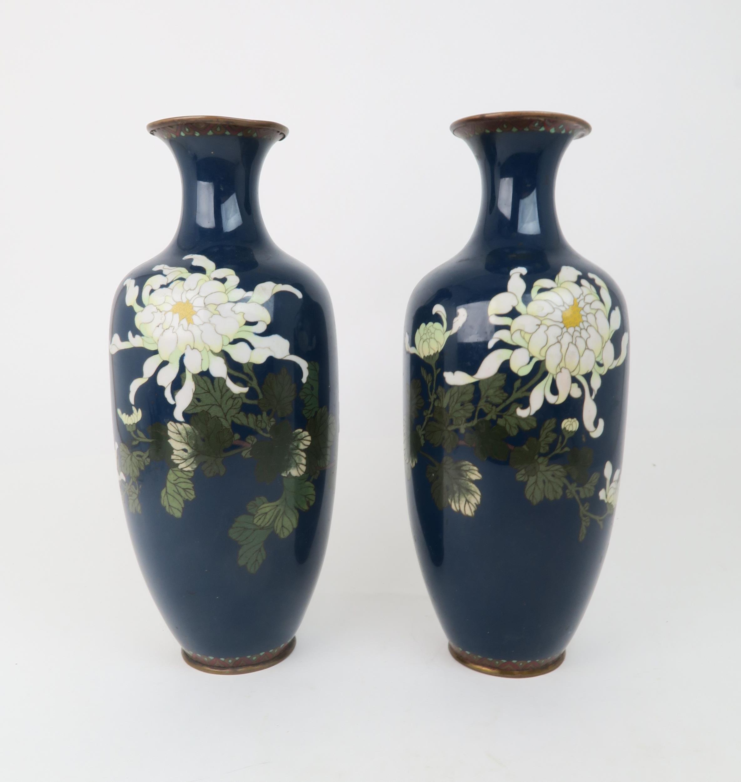 A PAIR OF JAPANESE CLOISONNE VASES Decorated with white peonies and foliage, 37cm high Condition