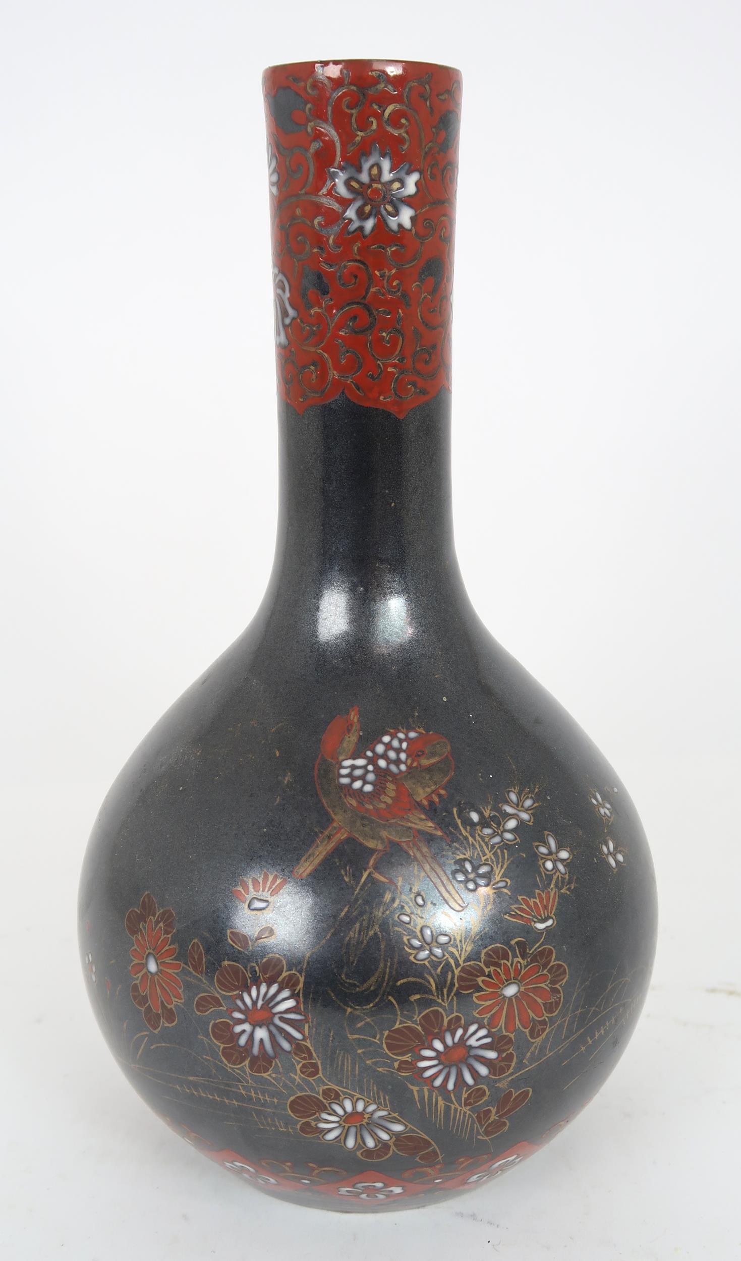 A CHINESE BALUSTER VASE  Painted with polychrome colours on a dark ground with birds amongst