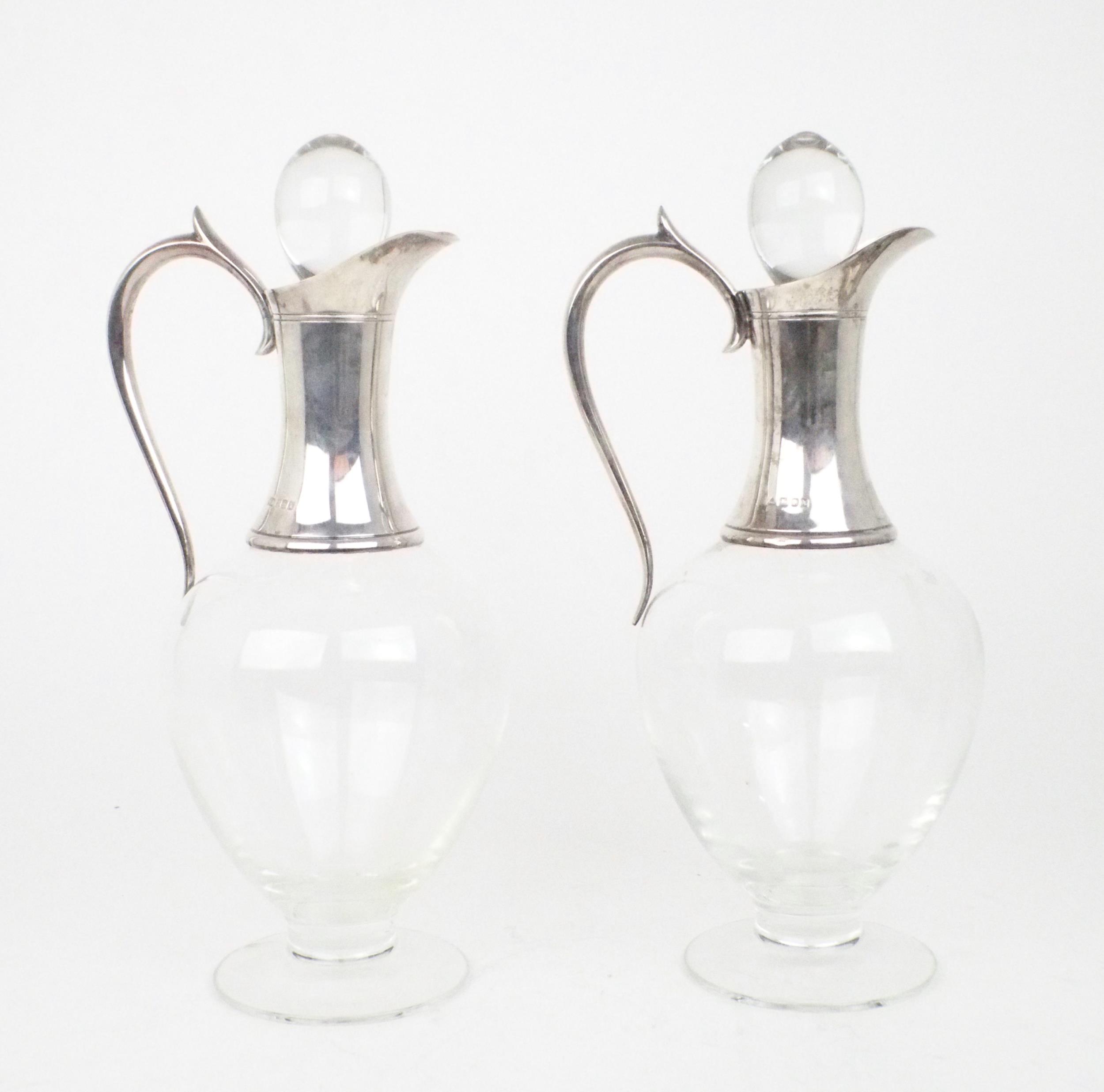 A PAIR OF ELIZABETH II SILVER COLLARED DARTINGTON CRYSTAL CLARET JUGS of baluster form, on a - Image 2 of 4