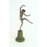 IN THE STYLE OF JOSEF LORENZL  a silvered Art Deco figure of a girl balancing on one foot with