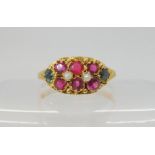 A VICTORIAN GEM SET RING hallmarked Birmingham 1876, set with pink and green gems and two pearls.