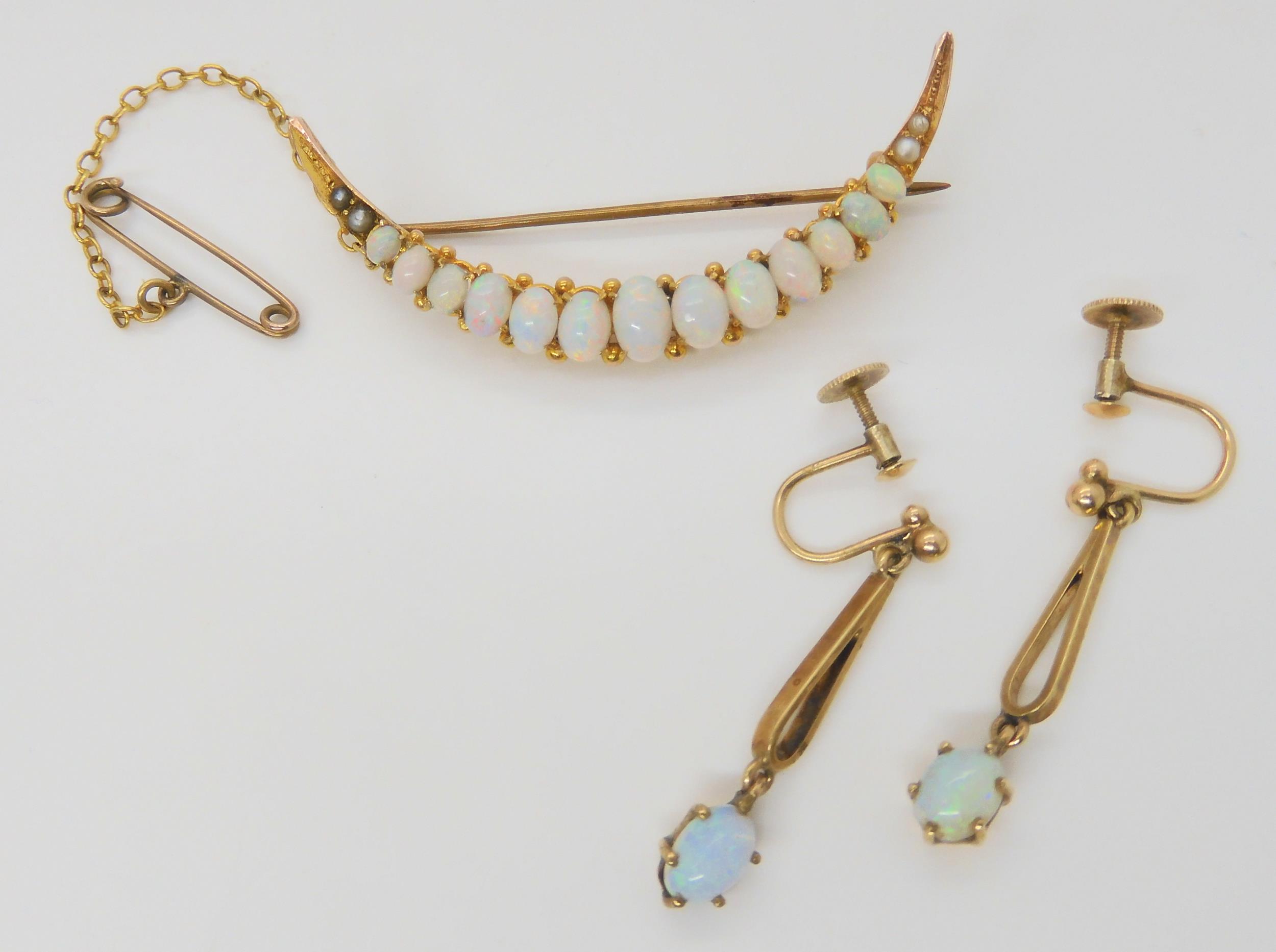 AN OPAL CRESCENT BROOCH & EARRINGS the brooch set with oval cabochon opals, largest approx 6mm x 4mm - Image 3 of 3