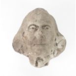A CARVED COMPOSITE STONE HEAD OF A MAN 28cm high Condition Report:Available upon request