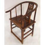 A CHINESE HARDWOOD HORSESHOE SHAPED ARMCHAIR with carved fret work splat on stretchered supports
