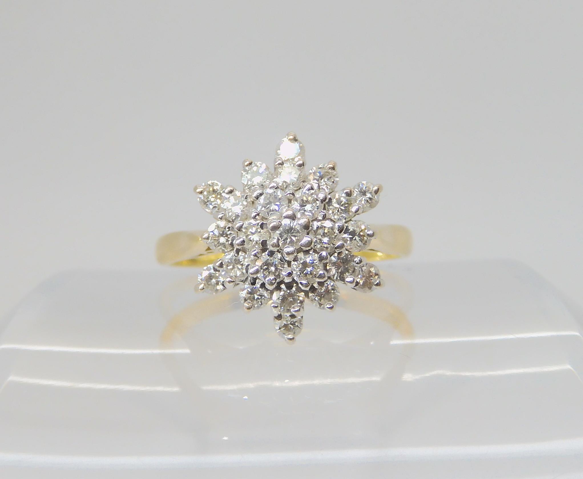 A DIAMOND SNOWFLAKE RING mounted throughout in 18ct yellow and white gold, set with estimated approx