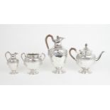 A VICTORIAN  SCOTTISH SILVER FOUR PIECE TEA SERVICE of swollen baluster form, the bodies with a band