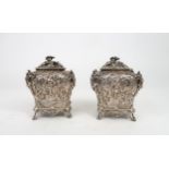 A PAIR OF WILLIAM IV SILVER CHINOSERIE TEA CADDIES of bombe form, profusely chased with rococo