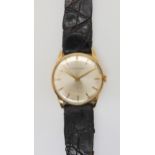 A 9CT GOLD GIRARD PEREGAUX WATCH with cream dial, gold baton numerals and hands. Diameter of the