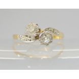 A TWIN STONE DIAMOND RING the bright yellow and white metal mount is set with two old cut