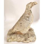 A 19TH/20TH CENTURY STONECAST STATUE OF AN EAGLE PERCHED ON ROCKS painted white, 56cm high Condition
