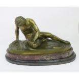 A 19TH CENTURY AFTER THE ANTIQUE BRONZE OF THE DYING GAUL modelled slumped with sword wound,